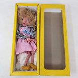A Pelham puppet, Girl, in original yellow box, cellophane missing