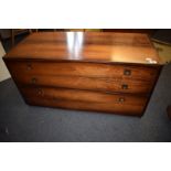 A Heal rosewood low chest, of three graduated long drawers, top slightly faded, 100.5 cm wide See