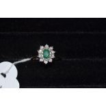 A 9ct gold, emerald and diamond cluster ring, approx. ring size M