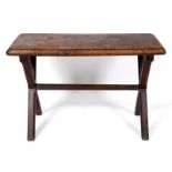 A 19th century oak pub type table, on chamfered X end supports joined by a similar stretcher, 116 cm