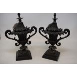 A pair of 19th century bronze urns and covers, decorated foliage, 23 cm high (2) Generally good,