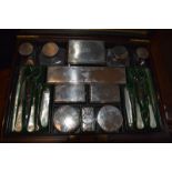 A Victorian rosewood travelling dressing case, the silver mounts initialled and ingraved scrolling