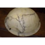 A carved alabaster ceiling shade, cracked, 50 cm diameter