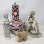 A Lladro group of a mother washing her child, 24 cm high, two other Lladro figures, six Royal