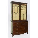 A 19th century mahogany secretaire bookcase, the moulded and dentil cornice above a pair of bar