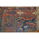 A Caucasian rug, with geometric motifs, 275 x 210 cm, and five other rugs (6)