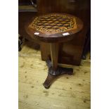 A Victorian mahogany occasional table, the top with geometric parquetry inlay, on a tapering