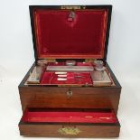 A Victorian travelling dressing case, with silver plated mounts, in a rosewood case, 32 cm wide