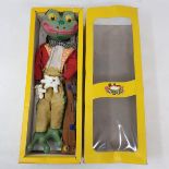 A Pelham puppet, Frog, in a yellow box