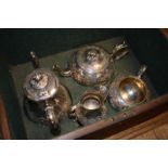 A Victorian silver plated four piece tea and coffee service, with embossed decoration, in a fitted
