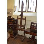 An artists oak studio easel, 64 cm wide Report by RB 254 cm high, with a winding handle, looks to