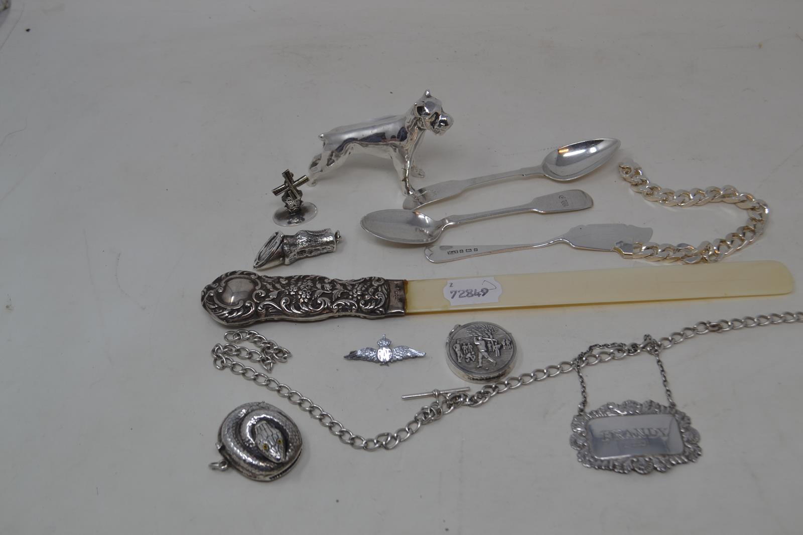 A silver mounted page turner, probably London 1896, two silver spoons, a silver decanter label,