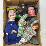 A Punch and Judy, two Baby puppets and the Dog