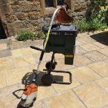 A Stihl RE118 pressure washer, an Atco Quiet Shredder 2000, and an Henchman platform ladder, and a