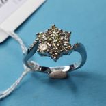 An 18ct white gold diamond cluster daisy ring, diamonds approx. 1.00ct