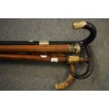 An alpine walking stick, with a horn handle, and three other walking sticks (4)