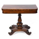 A William IV card table, the D-shaped top on a lotus leaf capped column, with a concave sided