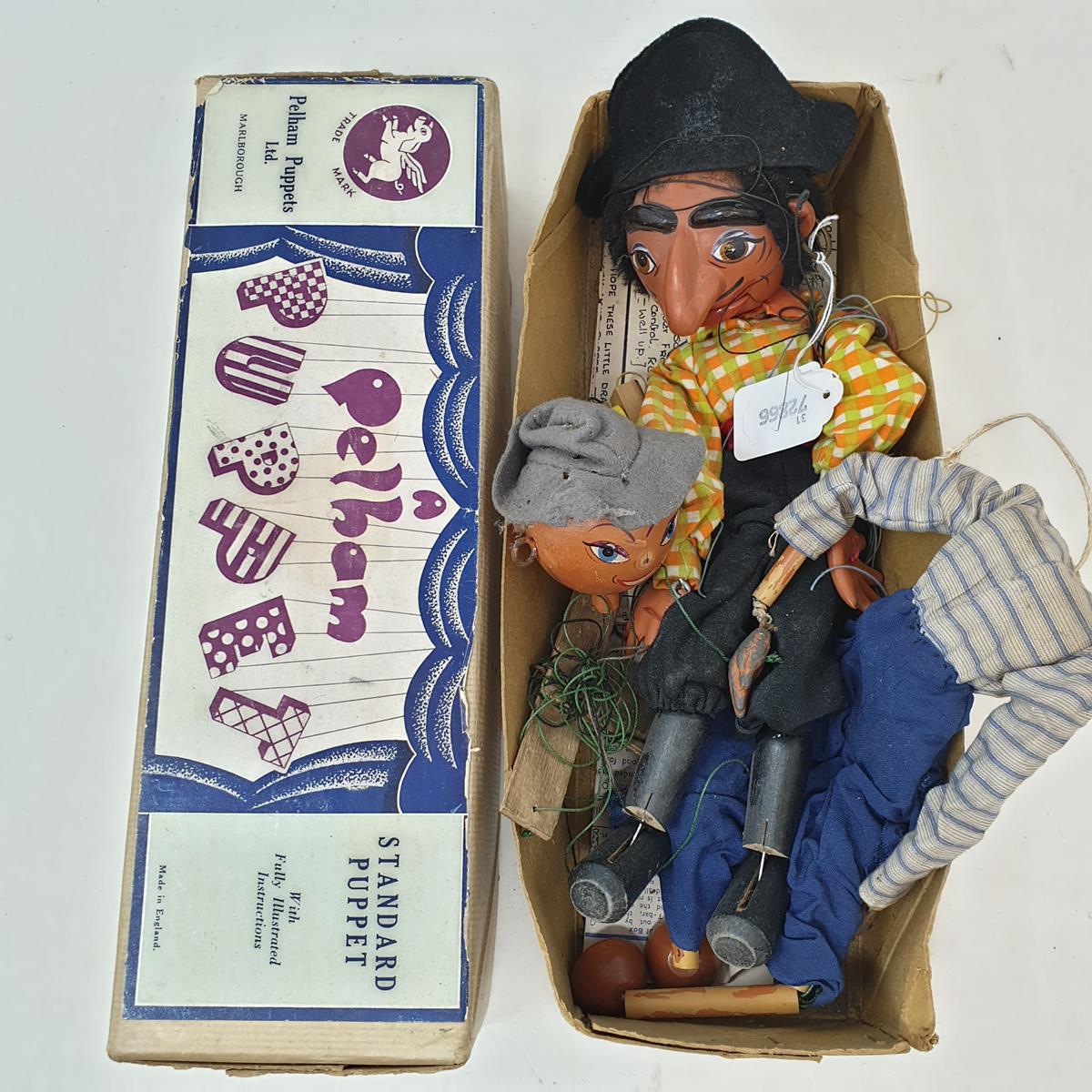 A Pelham puppet, Pirate, and another puppet, in a brown box (2)