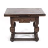 A 17th/18th century Dutch oak draw leaf table, of small proportions, on turn supports joined by