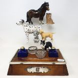 An Edwardian oak desk stand, with plated mounts, 29 cm wide, a leather mounted desk stand, two