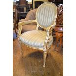 A Louis XVI style upholstered armchair, on tapering fluted front legs, and a Victorian mahogany