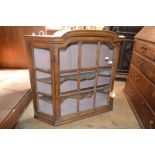 A Dutch oak hanging cupboard, with a bar glazed door, 94 cm wide