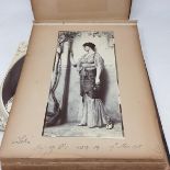 A photograph album, containing black and white images of portraits after J W Godward, variously