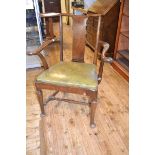 An 18th century style walnut carver chair, with a solid vertical splat, leather upholstered drop