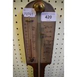 A George III style stick barometer, with a silvered register, in a mahogany case, 92 cm high