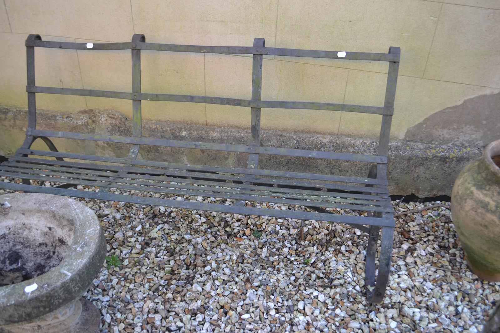 A Victorian style iron three seater garden bench, 152 cm wide From a local deceased estate where