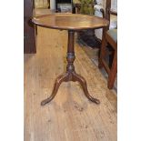 A 19th century mahogany tripod table, the dished top on a bars turned column, 53 cm diameter