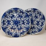 A pair of Dutch delft chargers, with floral decoration in underglaze blue, 35.5 cm diameter (2) Some