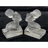 A pair of Lalique frosted glass Amour bookends, in the form of cupids, wheel cut marks, 19 cm