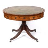 A 19th century mahogany drum top table, the leather inset top, above a frieze with four real and
