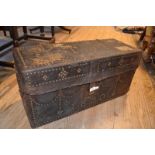 A leather covered travelling trunk, with stud work decoration, dated 1890, 76 cm wide Quite a lot of