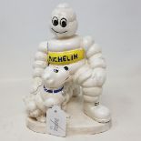 A painted iron figure, of the Michelin man and a dog, 20 cm high Modern