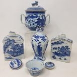 A Chinese porcelain stem cup, painted figures in underglaze blue, some loss, cracks, the base with a