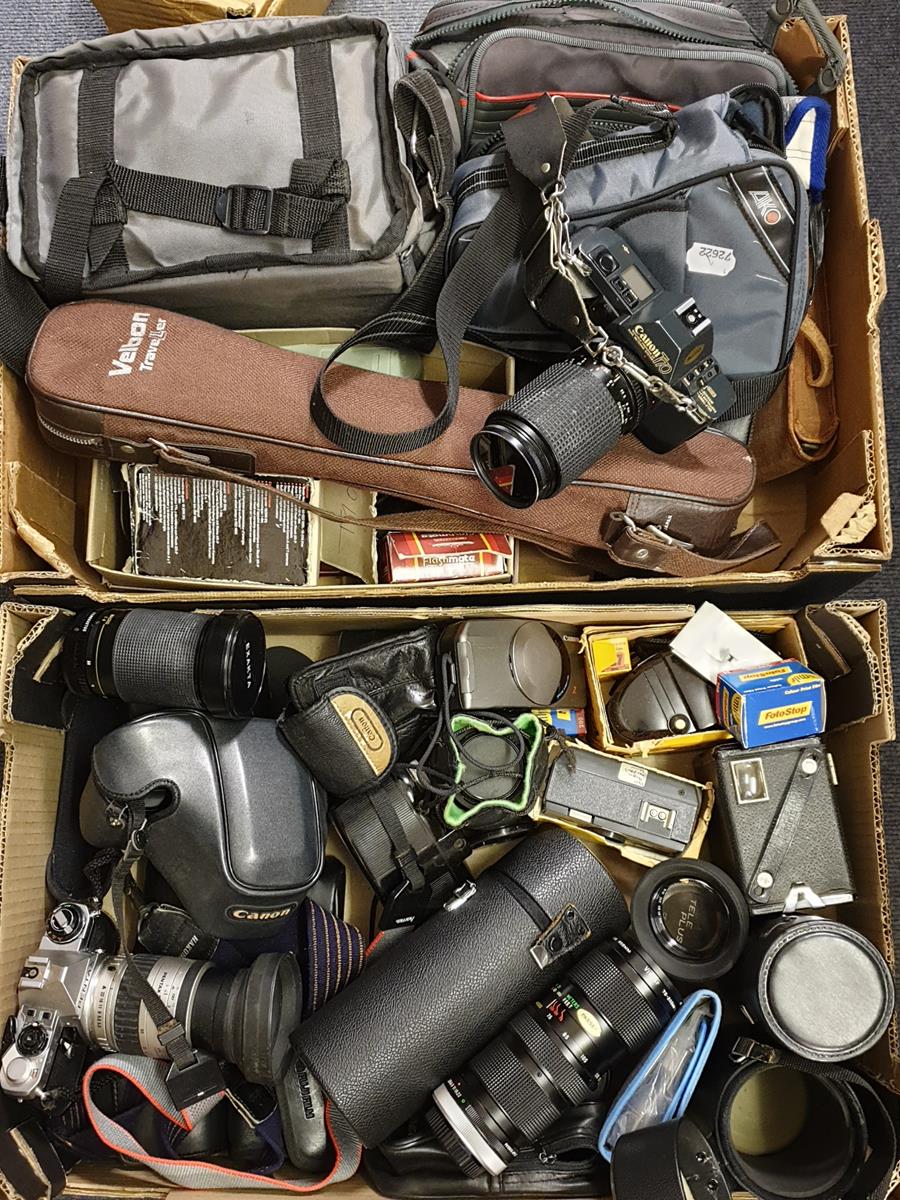 A Canon T70 camera, other assorted cameras, lenses and accessories (qty)