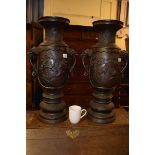 A large pair of Japanese bronze vases, decorated birds, flowers and foliage, 64 cm high By RB One