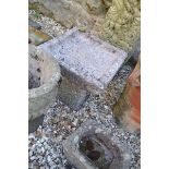 A granite bird bath, 35 cm wide x 36 cm high, a pair of reconstituted stone planters, 36 cm