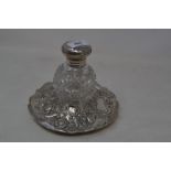 A Victorian silver and cut glass inkwell, embossed flowers and foliage, London 1891, approx. 5.3 ozt