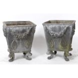 A pair of 18th century style lead garden planters, of tapering square form, decorated floral