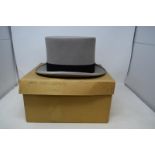 A Christy's top hat, named, in a cardboard box