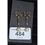 A pair of 9ct gold, amethyst and pearl bow top earrings Report by PM Age: 21st century Length: 37 mm