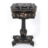 A Victorian papier mache work table, with gilt decoration and inlaid with mother of pearl and