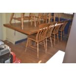 A craftsman made oak refectory table, the four plank top on end supports, 259 cm From a local