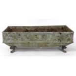 An 18th century style lead garden planter, decorated putti, on animal feet legs, 91.5 cm wide See