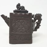 A Chinese Yixing stoneware teapot, the cover with a Dog of Fo finial and with tapered sides,