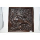 A late 19th century oak panel, carved in high relief a fox and dead birds, slight loss, 44 x 45