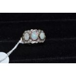 A 9ct gold, opal and diamond cluster ring, approx. ring size Q
